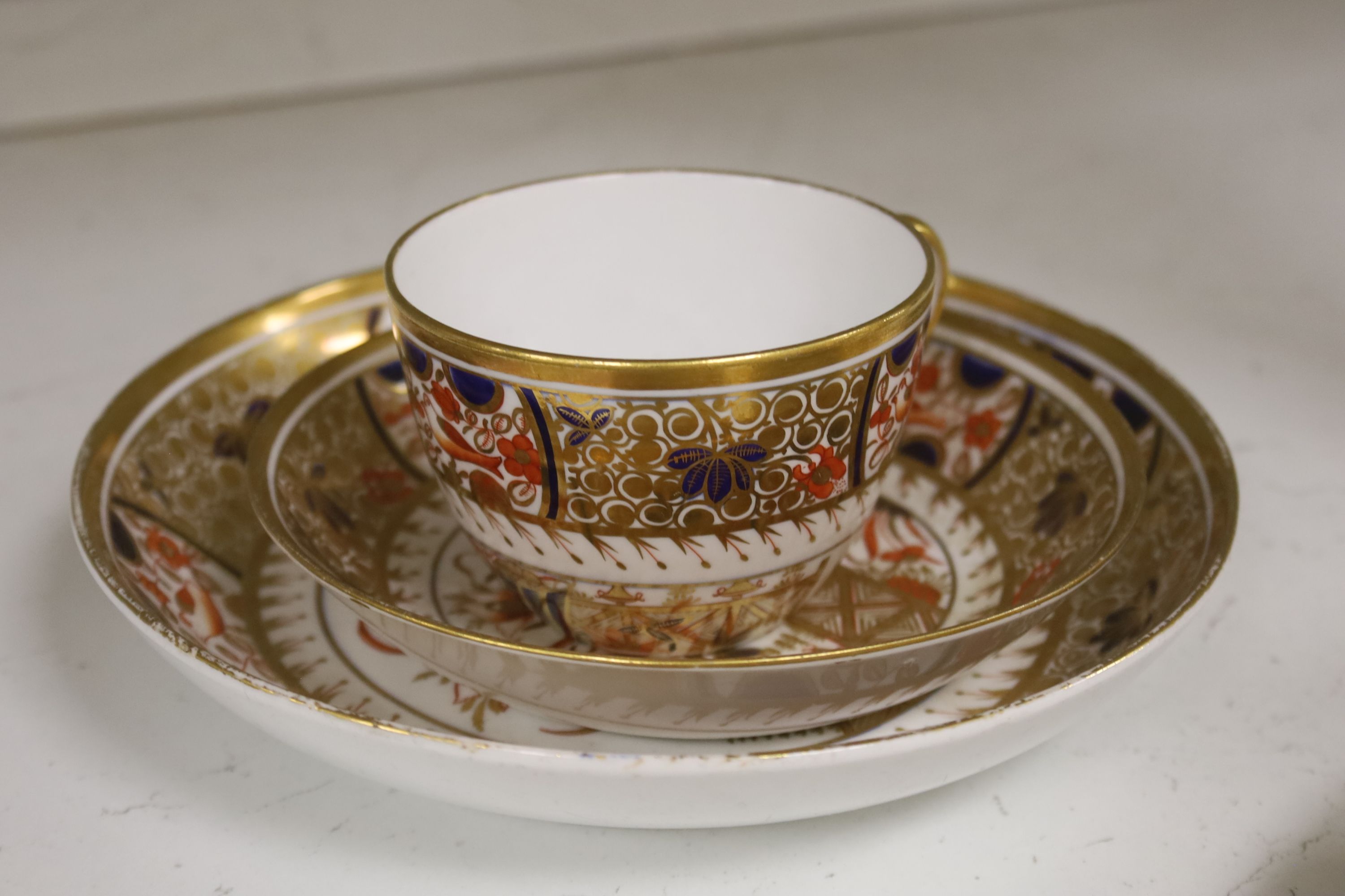 A set of six Spode teacups and saucers and a saucer dish painted with Imari pattern, amrked SPODE 1495